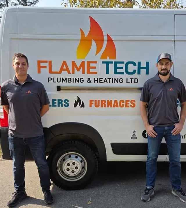 Jason Mounsey and Shaun Kristoff — FlameTech founders — standing in front of the service van